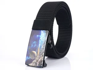 Macro shot of nylon tactical belt buckle featuring a star and planet galaxy art design