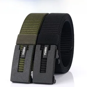 Detail of army green and black nylon belts with automatic buckle and TUSHI logo