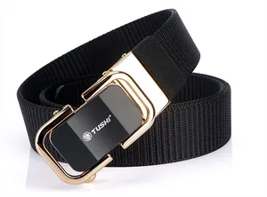 Detail of black nylon woven belt with golden automatic buckle and lion logo engraving
