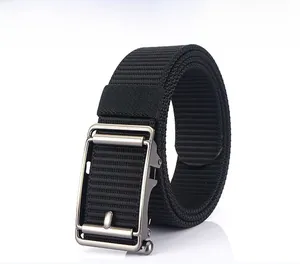 Close-up of black nylon belt with a silver automatic metal buckle and reflective base