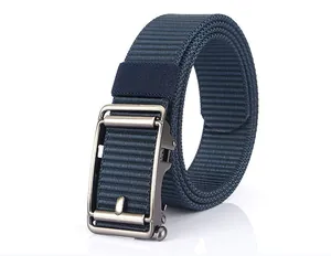 Detail view of a navy blue nylon belt with a textured weave and metallic automatic buckle