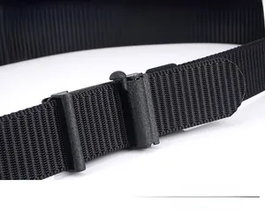 Macro detail of high-density black nylon belt showing the adjustable plastic buckle mechanism