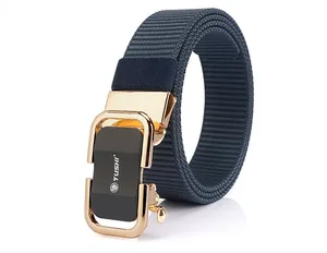 Detail of navy blue nylon woven belt with golden automatic buckle and TUSHI logo