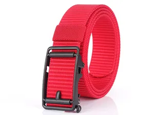 Detail of red nylon belt with matte black automatic buckle showing braided texture
