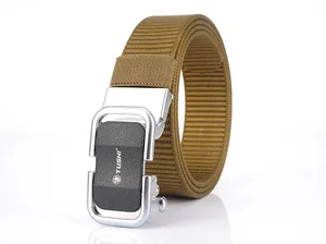 Close-up of TUSHI tactical nylon belt showing the silver alloy buckle and textured tan webbing