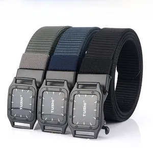 Detailed view of three nylon belts in grey, navy, and black with matte metal buckles