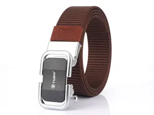 Detail of brown nylon belt with silver and black automatic metal buckle and TUSHI logo