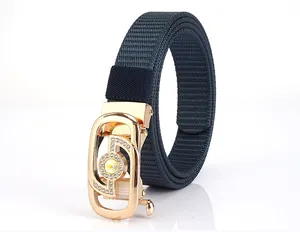 Detail of navy nylon braided belt featuring a gold rhinestone-encrusted buckle