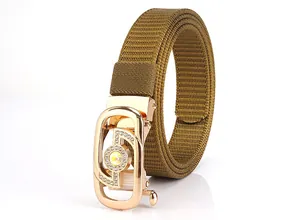 Detail of military green woven nylon belt with gold buckle and sparkling crystals