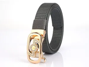 Close-up of gold alloy automatic buckle with shimmering rhinestones and grey woven belt