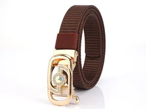 Detail of coffee brown braided nylon belt with golden rhinestone automatic buckle