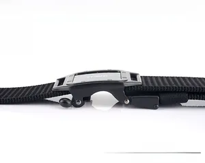 Detail of black metal toothless automatic buckle on nylon tactical belt with TUSHI logo