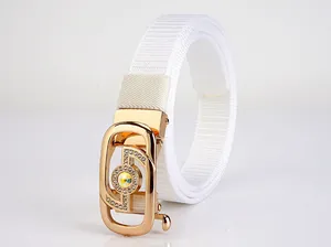 Close-up of white woven belt with gold buckle and sparkling colorful rhinestone detail