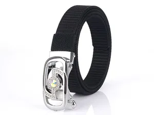 Detail of black nylon woven belt with a silver rhinestone-studded automatic buckle