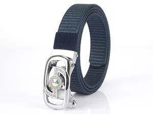 Close-up of navy nylon woven belt with a rhinestone-studded silver metal buckle