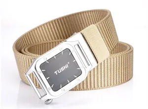 Detail of khaki nylon belt showing woven texture and polished metal automatic buckle