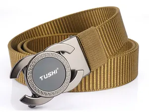 Detail of khaki nylon belt showing alloy buckle with intricate Greek fret pattern