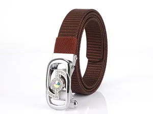 Detail of dark brown woven nylon belt with rhinestone encrusted silver buckle and gemstone