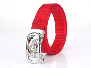 Detail of red woven nylon belt featuring a luxury rhinestone-studded silver buckle
