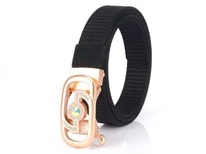 Macro detail of black nylon woven strap with rose gold rhinestone buckle and opal gem