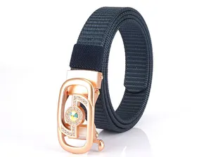 Detail of navy nylon braided belt with a rose gold buckle set with sparkling crystals