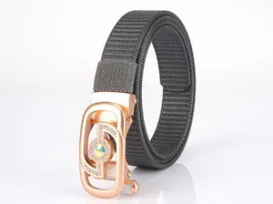 Grey nylon woven belt detail featuring a rose gold buckle set with colorful rhinestones