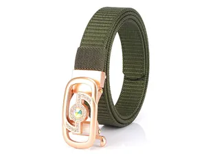 Detail of army green nylon woven belt with rose gold buckle and colorful crystal inlay