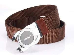 Close-up of brown nylon belt showing the silver alloy automatic buckle with Greek pattern