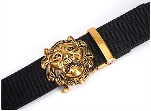 Detail of a 3D gold lion head buckle on a heavy-duty black nylon tactical belt