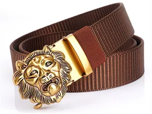 Detailed view of bronze lion head buckle on a brown nylon tactical belt for men