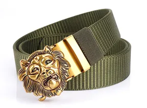Detailed close-up of golden lion head buckle on olive green tactical canvas belt
