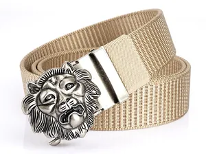 Detail of antique silver lion head metal buckle on a khaki nylon tactical belt