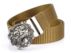 Detailed view of brown nylon tactical belt with embossed silver lion head metal buckle