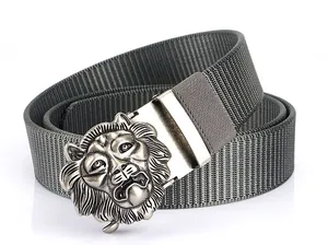Close-up of men's nylon tactical belt featuring a silver metal lion head embossed buckle