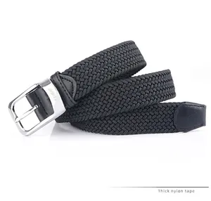 Detail of grey braided elastic belt featuring silver metal buckle and microfiber tail end