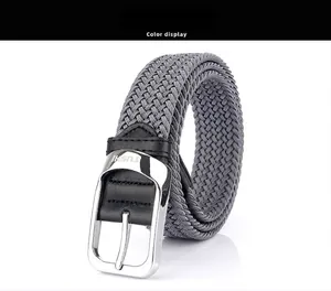 Detail of grey braided elastic belt with polished silver pin buckle and TUSHI logo