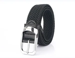 Detailed close-up of woven elastic belt fabric and engraved silver metal buckle with logo