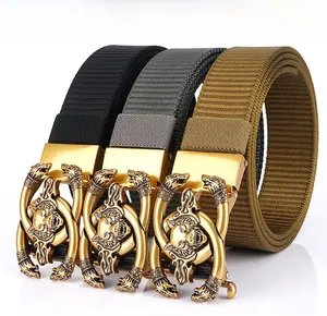 Detail of automatic gold buckle with embossed wolf head on nylon webbed outdoor belts