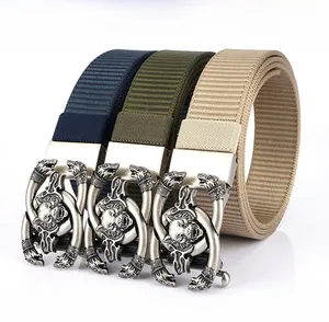 Detail of automatic zinc alloy buckles with wolf head relief on thick nylon tactical belts