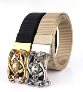 Detail of thickened tank pattern nylon belts in black and khaki with lion head alloy buckles