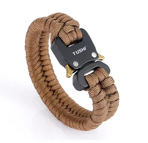 Detail of cobra weave paracord survival bracelet with TUSHI brand black metal buckle