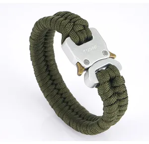 Detail of army green paracord survival bracelet featuring a silver metal tactical buckle