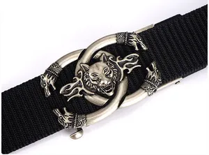 Detail of vintage silver wolf head buckle on thick black nylon tactical belt strap