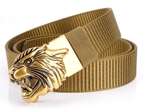 Detail of golden 3D tiger head buckle on a khaki tactical nylon belt with woven texture