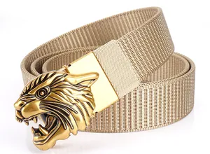 Detailed close-up of golden 3D tiger head buckle and khaki nylon tactical belt