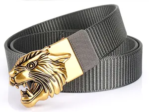 Detail of grey nylon belt with a 3D gold tiger head buckle and fine woven texture