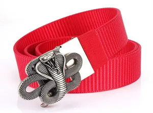 Close-up of red nylon belt with a detailed silver zinc alloy cobra buckle design