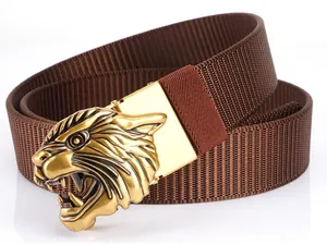 Detail of golden tiger head buckle on a brown heavy-duty nylon tactical web belt
