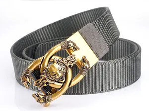 Detail of grey nylon belt featuring a golden alloy buckle with wolf head relief