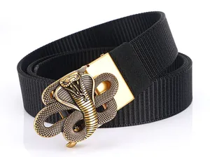 Detail of a golden cobra shaped metal buckle on a black woven nylon tactical belt